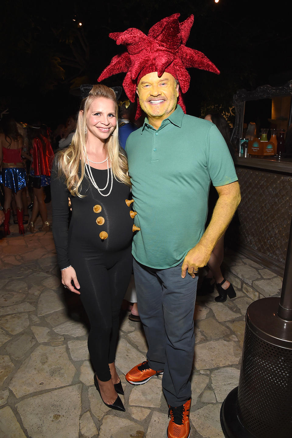 <p>The former <i>Frasier</i> star (with his pregnant wife, Kayte) cleverly dressed up as Sideshow Bob, the character he voices on <i>The Simpsons</i>. He earns extra points for the yellow body paint. (Photo: Michael Kovac/Getty Images) </p>