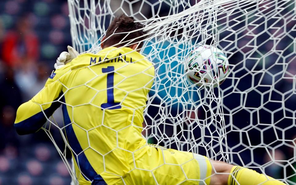 Scotland goalkeeper David Marshall crashes into the back of the net after conceding the second goal scored by Czech Republic's Patrik Schick (out of pic) during the UEFA Euro 2020 Group D match at Hampden Park, Glasgow. Picture date: Monday June 14, 2021.  - Andrew Milligan/PA