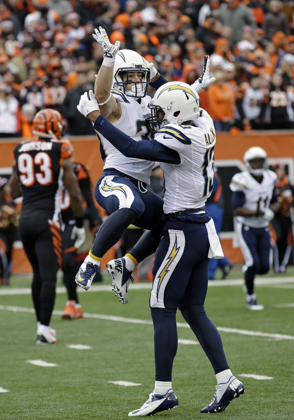 San Diego Chargers running back Danny Woodhead, left, celebrates his touchdown with wide receiver Keenan Allen in the first half of an NFL wild-card playoff football game against the Cincinnati Bengals, Sunday, Jan. 5, 2014, in Cincinnati. (AP Photo/Al Behrman)