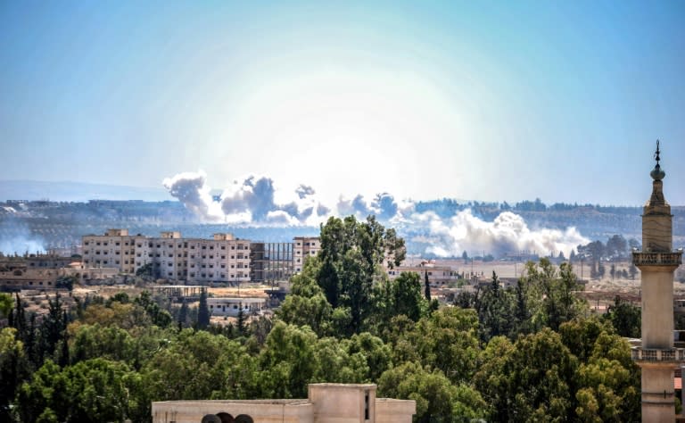 Smoke rises over rebel-held neighbourhoods of Daraa on June 27, 2018, day two of an air campaign for the southern city by the Syrian government and its Russian ally