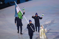 <p>Flag bearer Komiljon Tukhtaev of Uzbekistan during the Opening Ceremony of the PyeongChang 2018 Winter Olympic Games at PyeongChang Olympic Stadium on February 9, 2018 in Pyeongchang-gun, South Korea. (Photo by Ronald Martinez/Getty Images) </p>