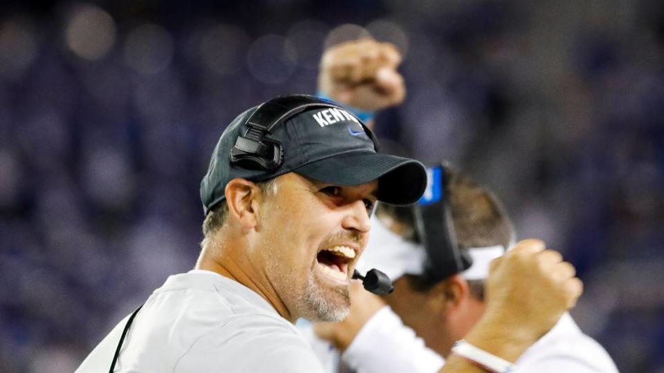 Kentucky Wildcats defensive coordinator Brad White celebrates a stop by his defense during the second half of a football game against Akron at Kroger Field in Lexington, Ky., Saturday, Sept. 16, 2023.