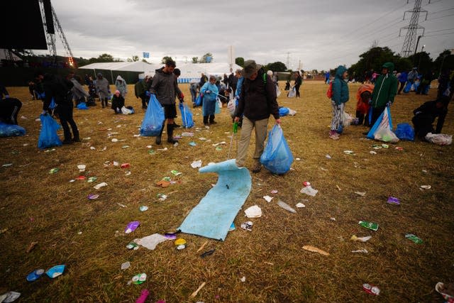 Litter pickers work to clear Worthy Farm