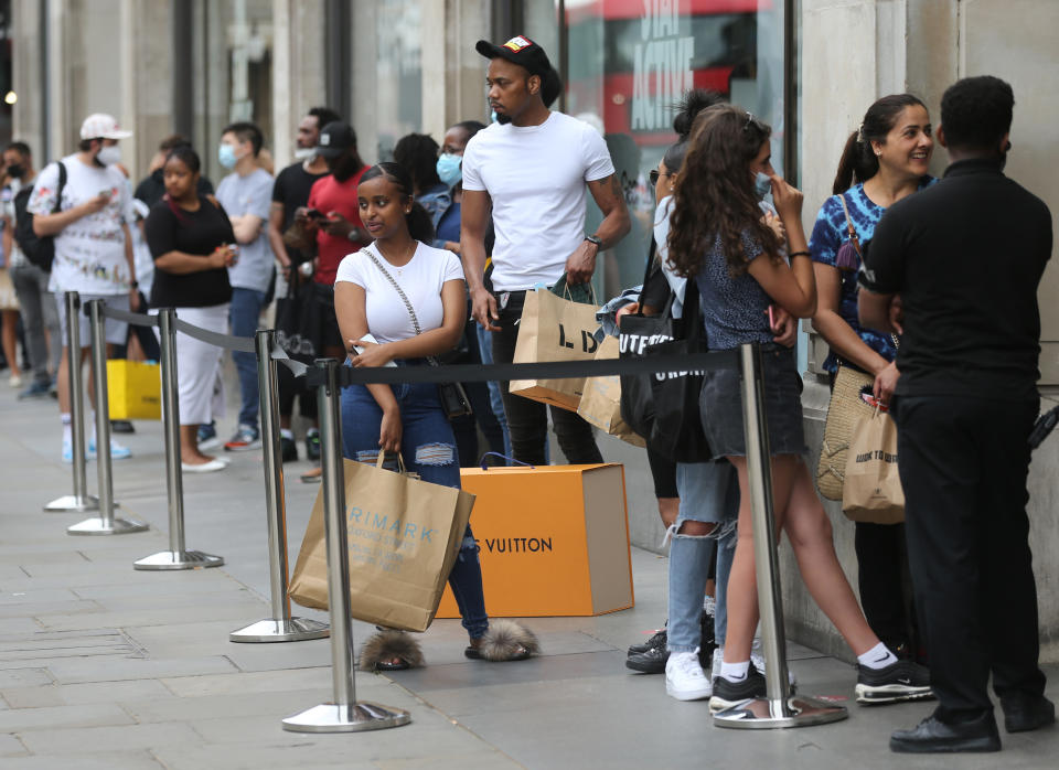 Shoppers queuing outside the Nike shop on Oxford Street, London, as non-essential shops in England open their doors to customers for the first time since coronavirus lockdown restrictions were imposed in March. Picture date: Monday June 15, 2020.