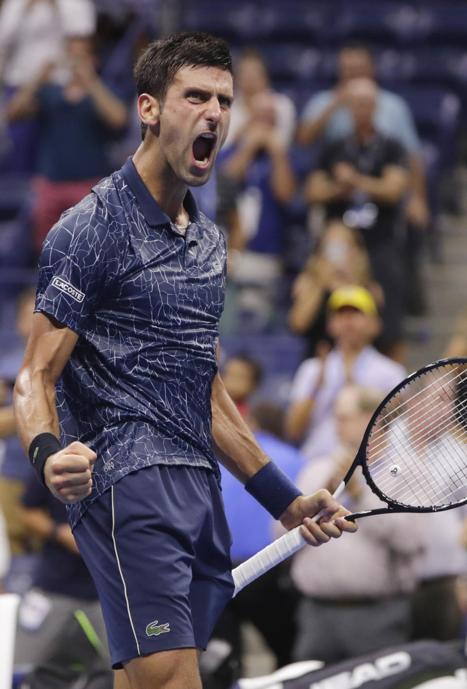 Novak Djokovic, of Serbia, celebrates after defeating John Millman, of Australia, 6-3, 6-4, 6-4 in the quarterfinals of the U.S. Open tennis tournament, Wednesday, Sept. 5, 2018, in New York. (AP Photo/Frank Franklin II)