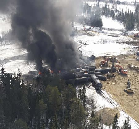 Smoke rises from fires caused by the derailment of a CN Railway train carrying crude oil near the northern Ontario community of Gogama, Ontario in this March 8, 2015 handout photo obtained by Reuters March 9. REUTERS/MPP Glenn Thibeault/Handout via Reuters