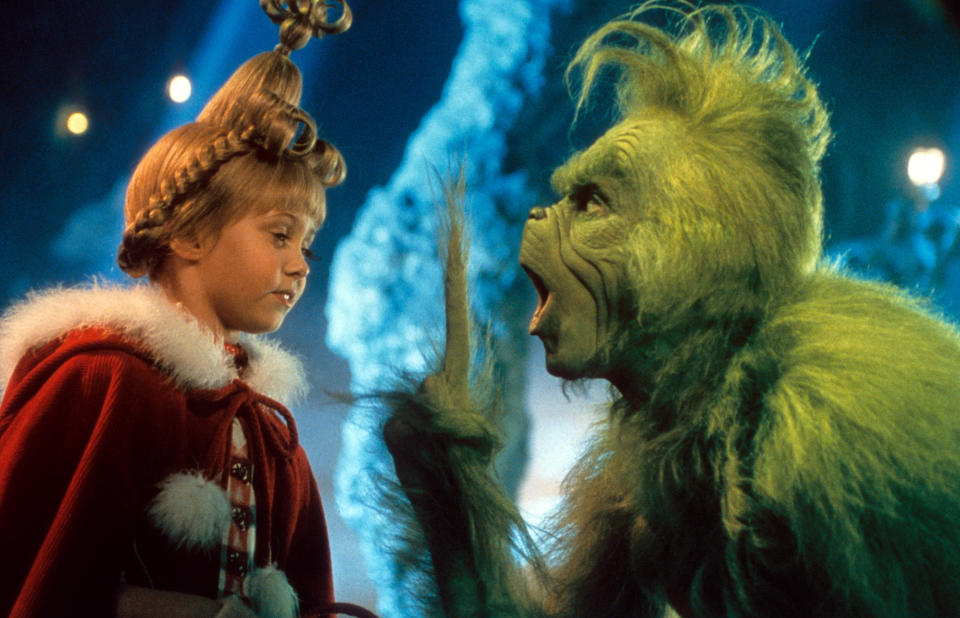 Taylor Momsen listening to Jim Carrey in a scene from the film 'How The Grinch Stole Christmas', 2000. (Photo by Universal/Getty Images)