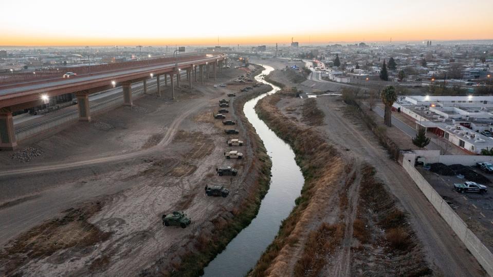 Texas National Guard stands guard on the north bank of the Rio Grande in El Paso, Texas on Dec. 20, 2022. The National Guard was deployed by Texas Governor Abbott in response to large numbers of asylum seekers arriving in El Paso. 