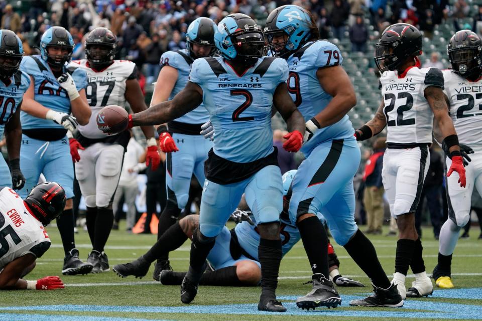 Arlington Renegades running back De'Veon Smith stands with the ball after a successful two-point conversation during the second half of Saturday's game against the Vegas Vipers at Choctaw Stadium in Arlington, Texas.