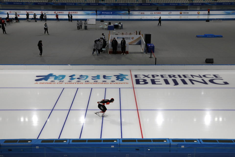 An athlete takes part in a speed skating competition held as a test event for the 2022 Olympic Winter Games, inside the National Speed Skating Oval, in Beijing, China April 7, 2021. REUTERS/Tingshu Wang