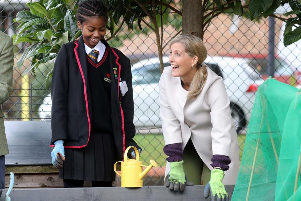 The Countess of Wessex smiles with a schoolgirl during a visit to see Vauxhall City Farm's community engagement and education programmes in action (REUTERS)