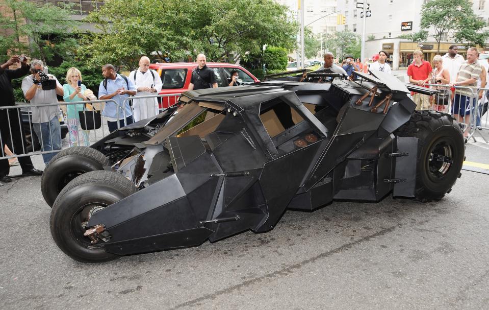 Batmobile surrounded by onlookers