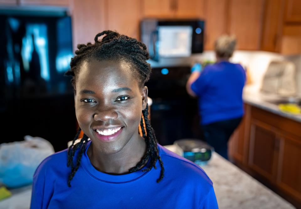 Lilian Okech stands for a photo while cleaning a unit at the Vintage Cooperative of Altoona, Wednesday, Dec. 7, 2022.