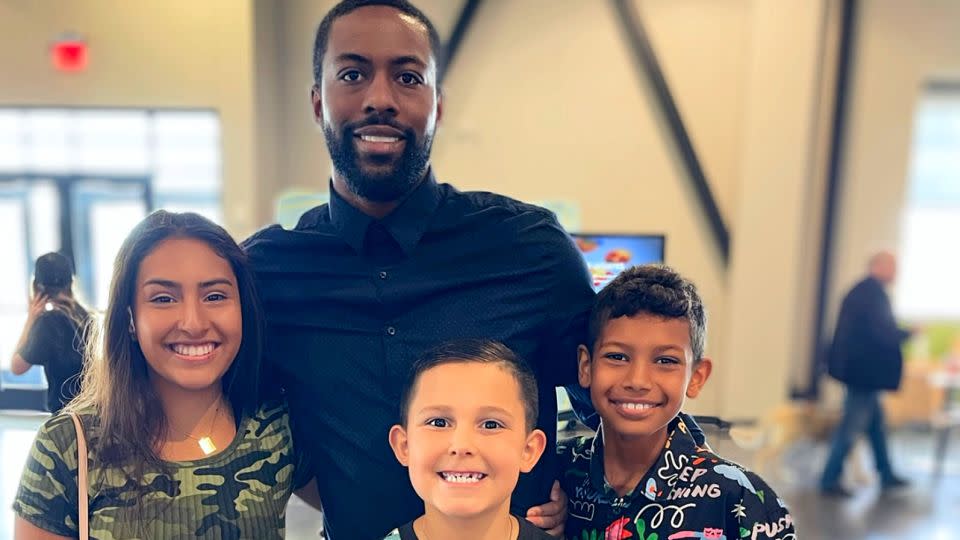 "A loving Black dad raised me and a loving Black dad raised him. They weren’t an exception and laid a solid foundation for me to become the dad that I have become," said Hooks (center back row), shown with his three kids (from left), Alecia Hooks, Braylon Hooks and Zayden Hooks. Hooks is a tech-cybersecurity consultant. - Courtesy Anthony Hooks