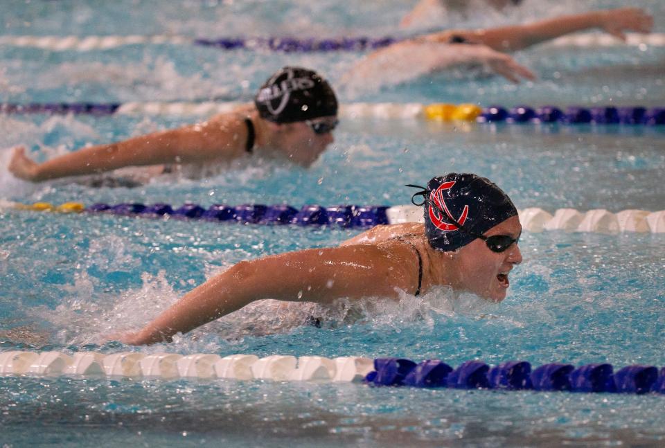 Churchill's Kelsey Wasikowski, right, swims in the girls 200 yard individual medley against Springfield's Kassandra McLennan, left, during the 5A Midwestern League district meet at Willamalane Pool in Springfield Saturday, Feb. 11, 2023.