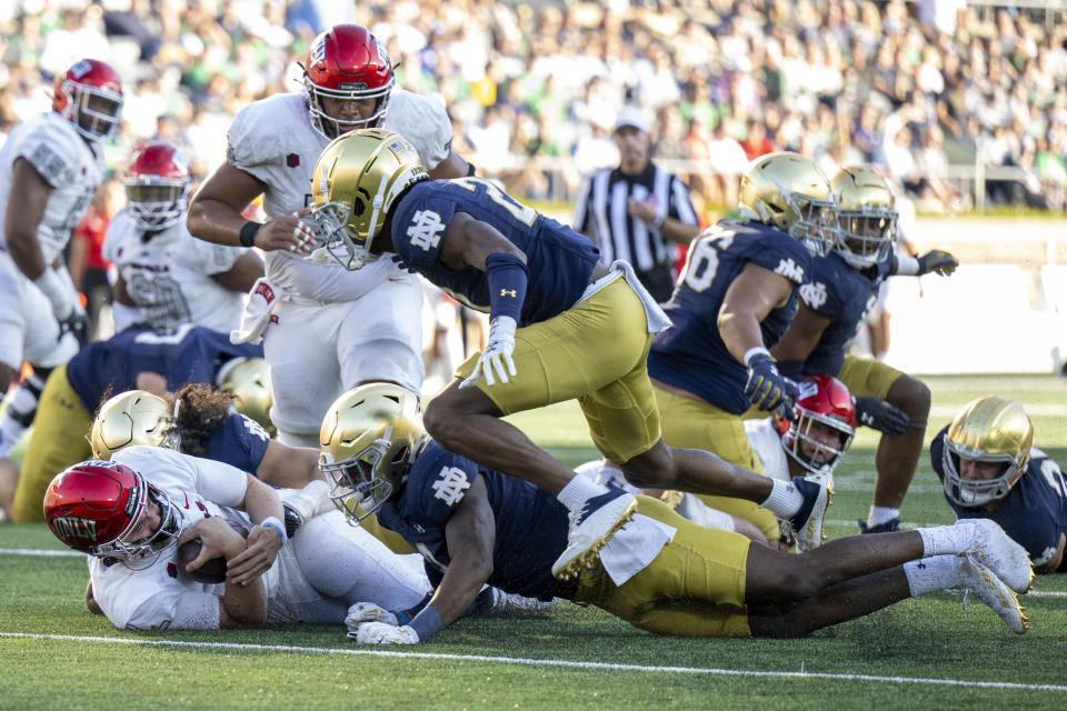 UNLV quarterback Harrison Bailey (5) is tackled during the second half of an NCAA college football game against Notre Dame, Saturday, Oct. 22, 2022, in South Bend, Ind. (AP Photo/Marc Lebryk)