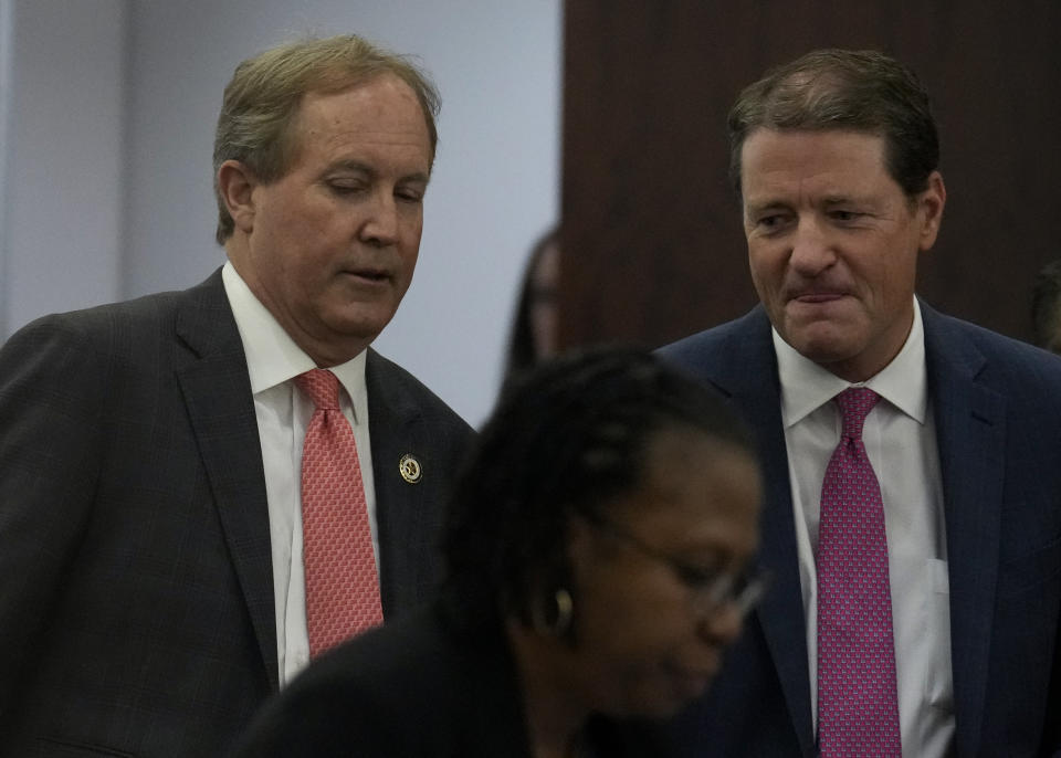 Texas Attorney General Ken Paxton appears at a pretrial hearing in his securities fraud case before state District Judge Andrea Beall in the 185th District Court Tuesday, March 26, 2024 at Harris County Criminal Courts at Law in Houston. Paxton, on Tuesday, agreed to pay nearly $300,000 in restitution under a deal to end criminal securities fraud charges that have shadowed the Republican for nearly a decade. (Yi-Chin Lee/Houston Chronicle via AP)