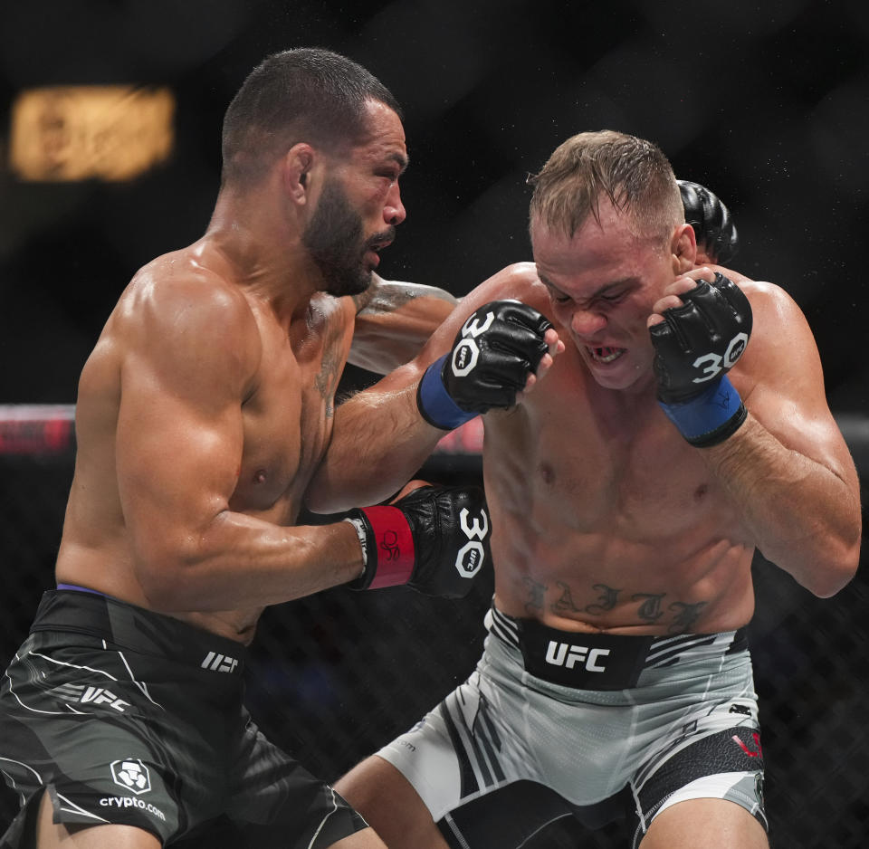 Dan Ige, left, and Nate Landwehr fight during a featherweight bout at UFC 289 in Vancouver, British Columbia on Saturday, June 10, 2023. (Darryl Dyck/The Canadian Press via AP)