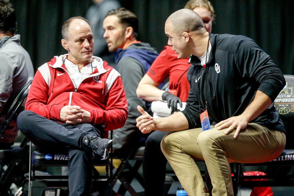 OU wrestling coach Lou Rosselli talks to an assistant during the NCAA Championships on March 17 at BOK Center in Tulsa.