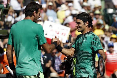 Mar 27, 2017; Miami, FL, USA; Roger Federer of Switzerland (R) shakes hands with Juan Martin del Potro of Argentina (L) after their match on day seven of the 2017 Miami Open at Crandon Park Tennis Center. Mandatory Credit: Geoff Burke-USA TODAY Sports