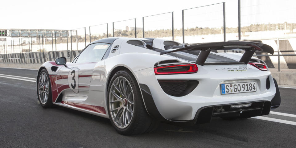 <p>Although it puts 887 hp to all four wheels, the rear tires on the 918 Spyder are still ridiculously wide. The front wheels are driven by an electric motor, helping the car hit 0-62 in 2.6 seconds and <a rel="nofollow noopener" href="http://www.roadandtrack.com/new-cars/first-drives/reviews/a6138/2015-porsche-918-spyder-first-drive/" target="_blank" data-ylk="slk:lapping the Nürburgring in just 6:57;elm:context_link;itc:0;sec:content-canvas" class="link ">lapping the Nürburgring in just 6:57</a>.</p>