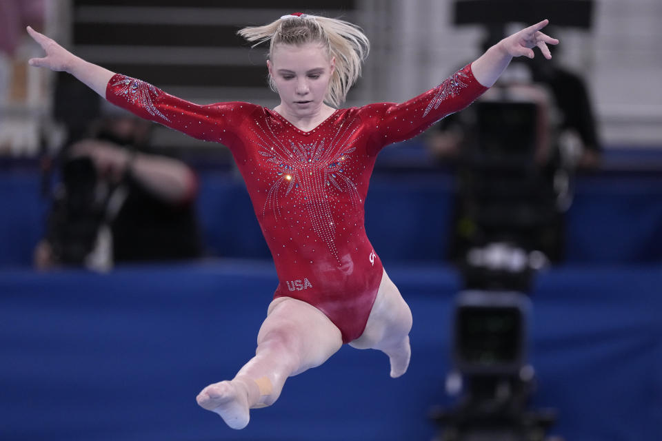 Jade Carey, of the United States, performs on the balance beam during the women's artistic gymnastic qualifications at the 2020 Summer Olympics, Sunday, July 25, 2021, in Tokyo. (AP Photo/Gregory Bull)