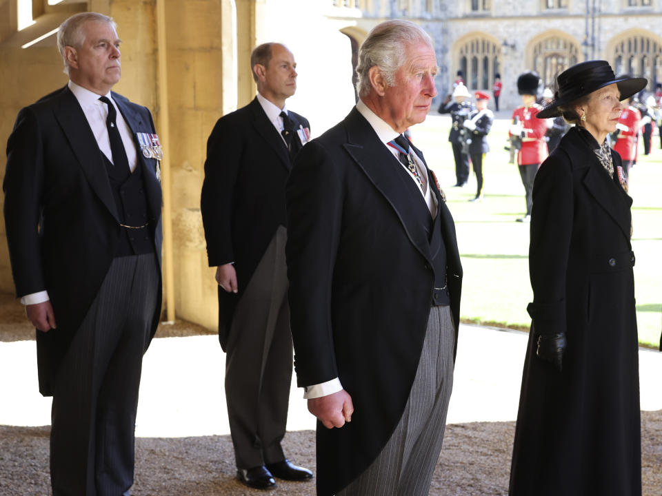 From left, Prince Andrew, Prince Edward, Prince Charles and Princess Anne arrive after walking in a procession behind the coffin of Prince Philip, with other members of the Royal family during the funeral of Britain's Prince Philip inside Windsor Castle in Windsor, England, Saturday, April 17, 2021. Prince Philip died April 9 at the age of 99 after 73 years of marriage to Britain's Queen Elizabeth II. (Chris Jackson/Pool via AP)
