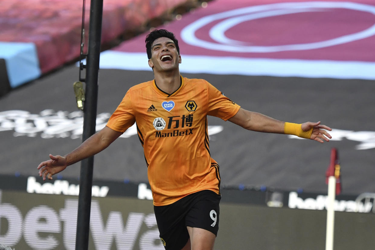 Wolverhampton Wanderers' Raul Jimenez celebrates after scoring his side's first goal during the English Premier League soccer match between West Ham and Wolverhampton at London stadium in London, England, Saturday, June 20, 2020. (Ben Stansall/Pool via AP)