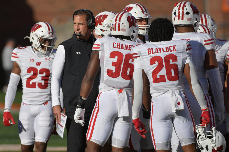 Oct. 21, 2023; Champaign, Illinois; Wisconsin Badgers head coach Luke Fickell with his players during the first half against the Illinois Fighting Illini at Memorial Stadium. Ron Johnson-USA TODAY Sports