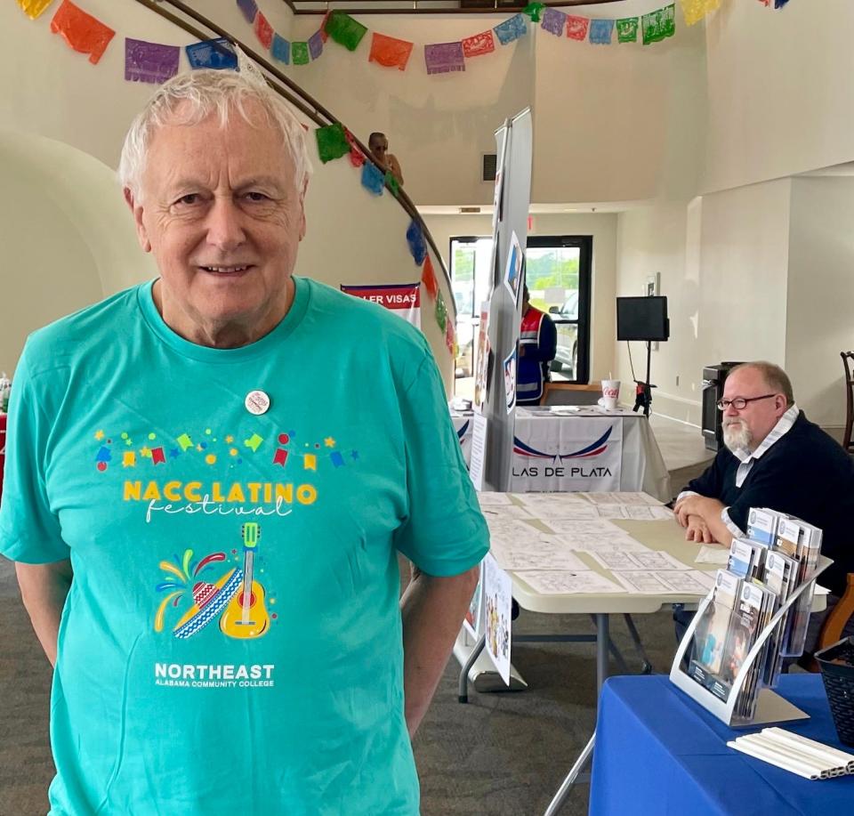 Dr. David Campbell greets visitors of the Latino Festival inside the Tom Bevill Lyceum at Northeast Alabama Community College on June 10, 2023.