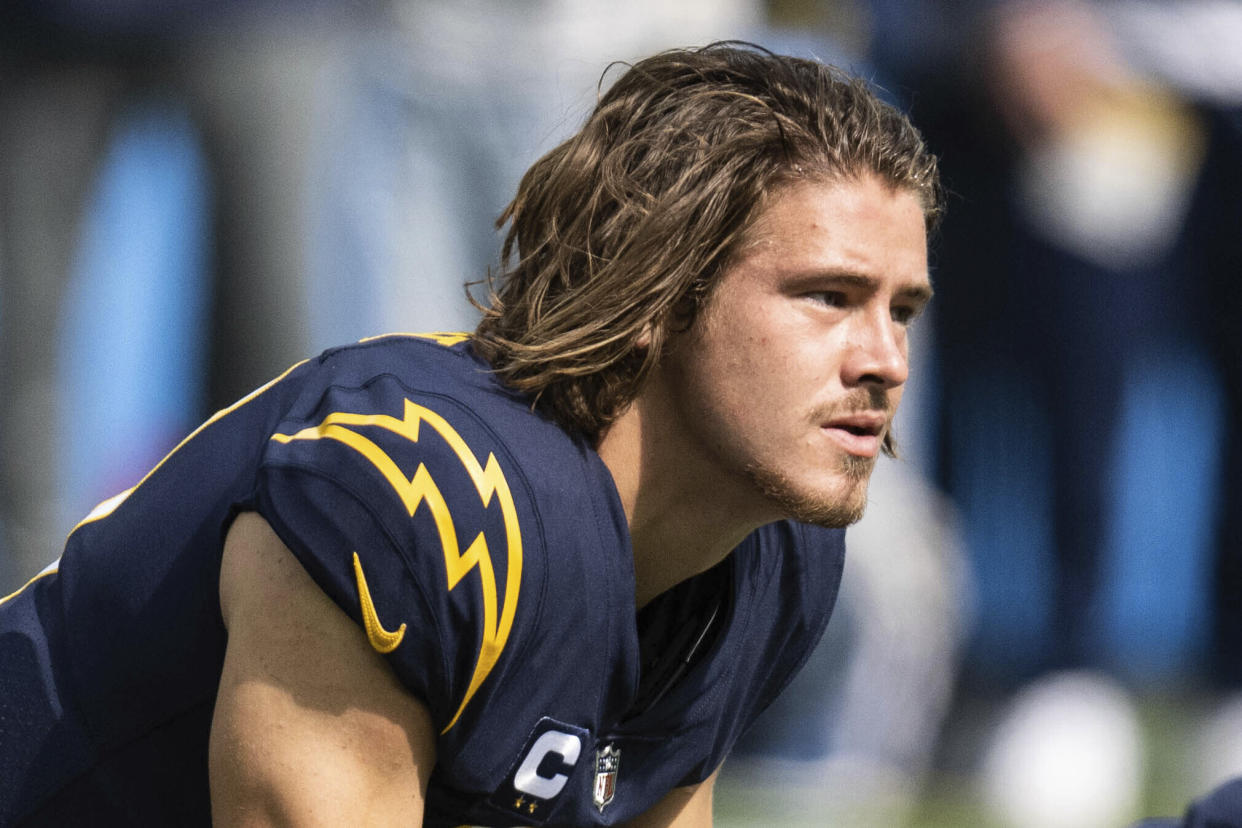 Los Angeles Chargers quarterback Justin Herbert (10) warms up before an NFL football game against the Seattle Seahawks, Sunday, Oct. 23, 2022, in Inglewood, Calif. (AP Photo/Kyusung Gong)