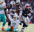 <p>Dolphins quarterback Ryan Tannehill is dejected after Patriots Adam Butler (right) sacked him in the third quarter. New England Patriots hosted the Miami Dolphins at Gillette Stadium in Foxborough, MA on Sept. 30, 2018. (Photo by Jim Davis/The Boston Globe via Getty Images) </p>