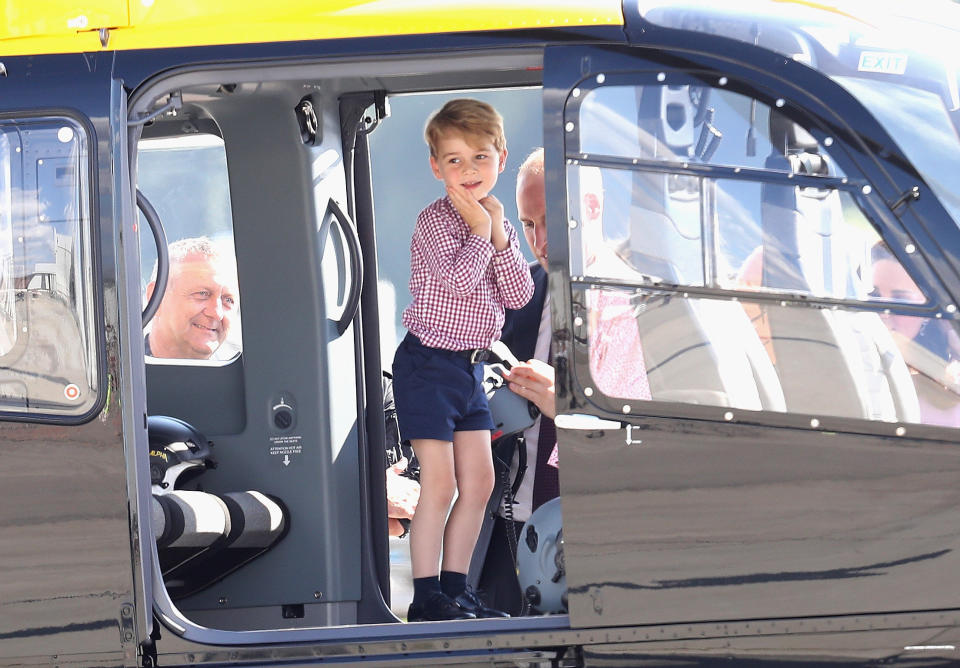 Prince George views helicopter models before departing from Hamburg, Germany, airport on the last day of the family's official visit to Poland and Germany on July 21, 2017.