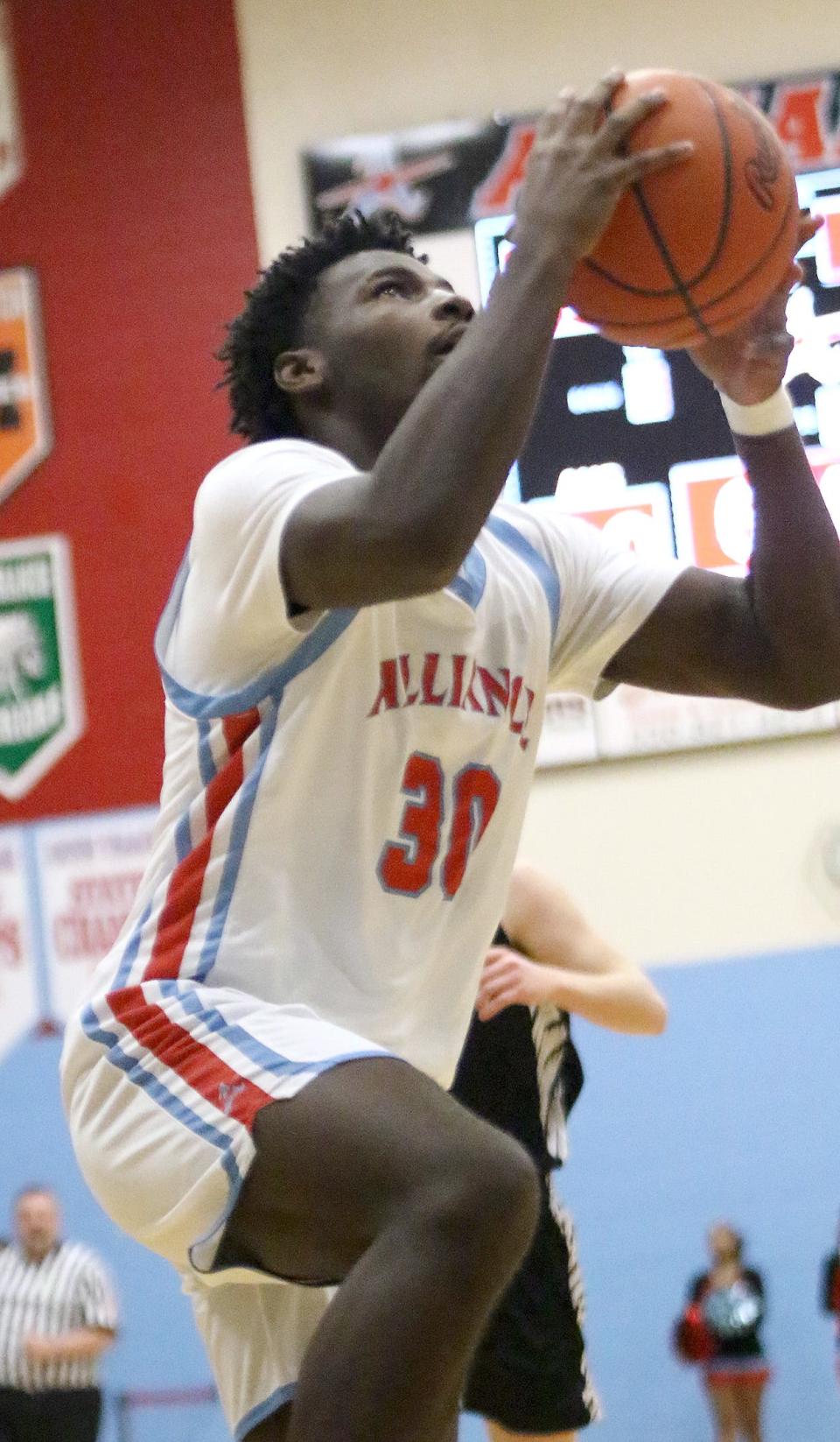 Alliance's Nino Hill puts up a shot against Carrollton during conference action at Alliance High School on Tuesday.