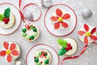 <p>Enjoy tiny treats with trimmings such as M&M's and marshmallows. Pressed Laffy Taffy leaves lend a festive touch.</p><p><strong><a href="https://www.countryliving.com/food-drinks/recipes/a40487/christmas-candy-cupcakes-recipe/" rel="nofollow noopener" target="_blank" data-ylk="slk:Get the recipe" class="link ">Get the recipe</a>.</strong></p>