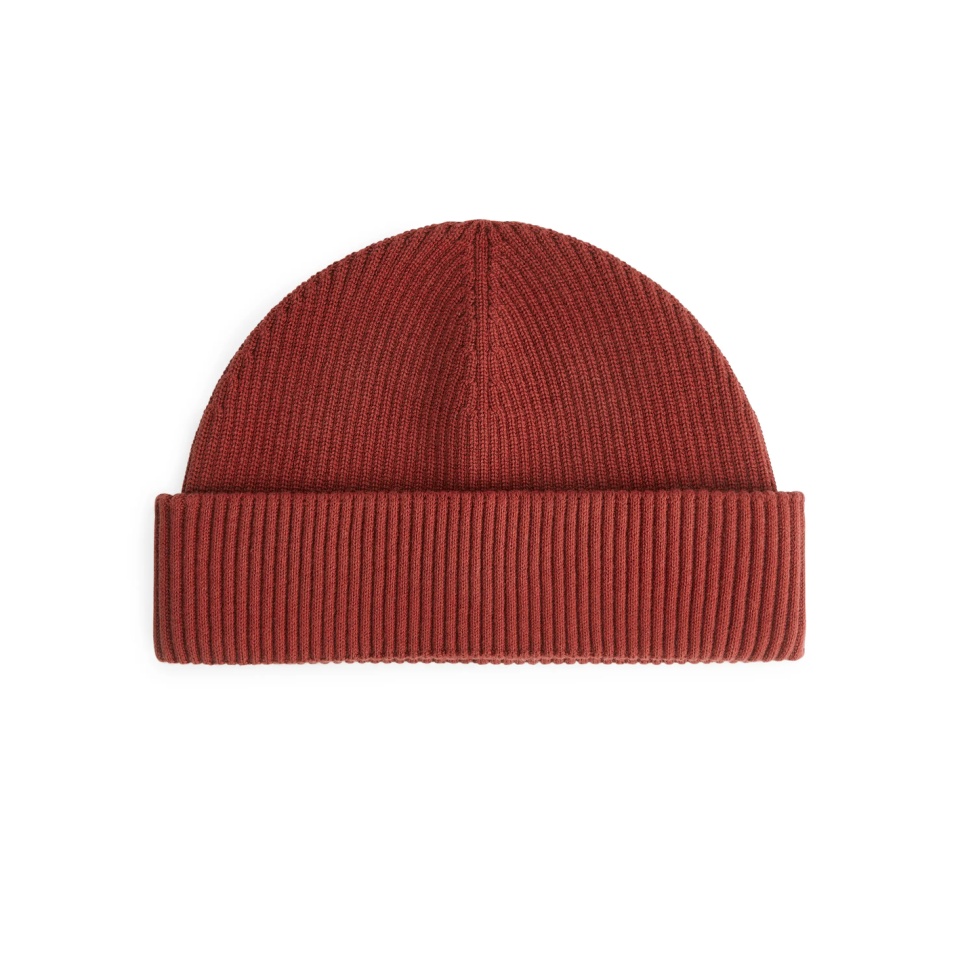 <p><a class="link " href="https://www.arket.com/en_gbp/men/bags-accessories/product.short-ribbed-cotton-beanie-orange.0809193012.html" rel="nofollow noopener" target="_blank" data-ylk="slk:SHOP;elm:context_link;itc:0;sec:content-canvas">SHOP</a></p><p>Affordable and essential, everyone needs a trusty beanie. Make it this terracotta number from Scandi brand Arket.</p><p>£25, Arket</p>