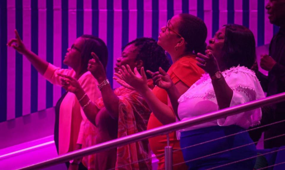 Congregants stand in praise during Sunday service at Tabernacle of Glory, a nondenominational church with a large Haitian American following. The church has 62 locations worldwide and opened a new $60 million campus in north Miami Dade.