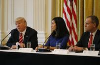 U.S. President Donald Trump (L) meets with technology and telecommunications executives, including Dyan Gibbens from Trumbull Unmanned and Darius Adamczyk (R) from Honeywell, at the White House in Washington, U.S., June 22, 2017. REUTERS/Jonathan Ernst