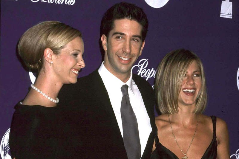 Lisa Kudrow (L), David Schwimmer and Jennifer Aniston attend the People's Choice Awards at the Pasadena Civic Auditorium January 7, 2001, in Pasadena, Calif. "Friends" debuted on NBC on September 22, 1994. File Photo by Russ Einhorn/UPI