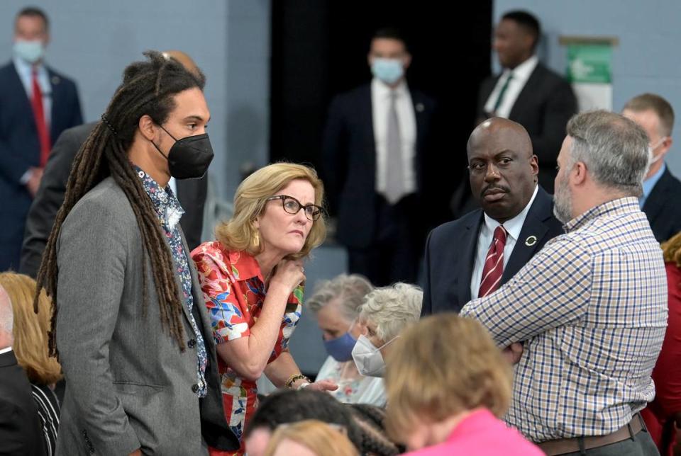 (L-R) Charlotte City Council members Braxton Winston, Julie Eiselt, Malcolm Graham and Larken Egleston gather while waiting for Vice President Kamala Harris to speak on the Affordable Connectivity Program (ACP) at the Carole A. Hoefener Community Services Center in Charlotte, NC on Thursday, July 21, 2022. JEFF SINER/jsiner@charlotteobserver.com