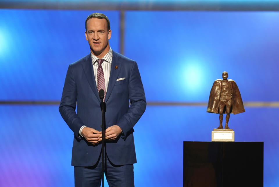 FILE - In this Feb. 2, 2019, file photo, former NFL player Peyton Manning presents the Walter Payton NFL man of the year award at the 8th Annual NFL Honors at The Fox Theatre in Atlanta. Just as he had the true touch when he threw passes, set records and won two Super Bowls on the field, Peyton Manning possesses the right approach to look back at some of the NFL’s greatest moments. Manning, a lock for the Pro Football Hall of Fame when he becomes eligible in 2021, is hosting and serves as one of the executive producers for “Peyton’s Places,” a five-part, 30-episode series that celebrates the NFL’s 100th season. (Photo by Paul Abell/Invision for NFL/AP Images, File)