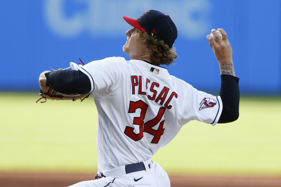 Cleveland Guardians starting pitcher Zach Plesac throws to a Cincinnati Reds batter during the second inning of a baseball game Tuesday, May 17, 2022, in Cleveland. (AP Photo/Ron Schwane)