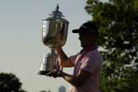 Justin Thomas holds the Wanamaker Trophy after winning the PGA Championship golf tournament in a playoff against Will Zalatoris at Southern Hills Country Club, Sunday, May 22, 2022, in Tulsa, Okla. (AP Photo/Eric Gay)
