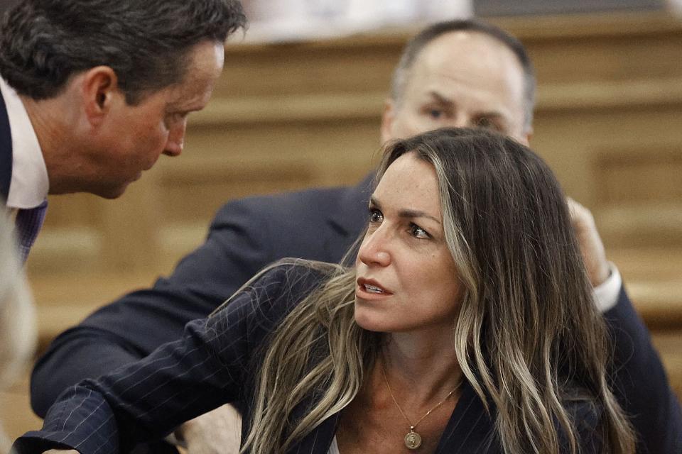 Karen Read speaks with her lawyer as the jury deliberates in her murder trail, Wednesday June 26, 2024, at Norfolk Superior Court in Dedham, Mass. Read is charged with second-degree murder in the January 2022 death of her boyfriend Boston Police Officer John O’Keefe. (Greg Derr/The Patriot Ledger via AP, Pool)