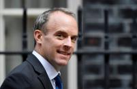 FILE PHOTO: Britain's Foreign Affairs Secretary Dominic Raab walks outside Downing Street in London