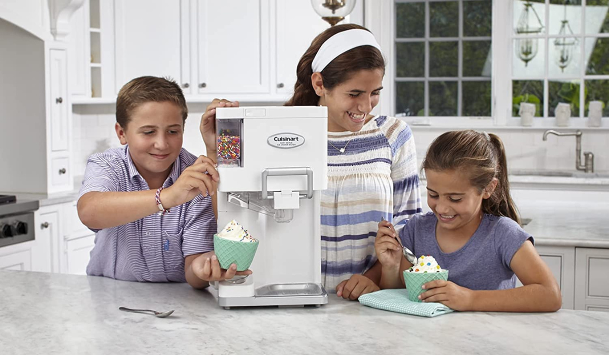 three people eating and dispensing ice cream from the ice cream maker