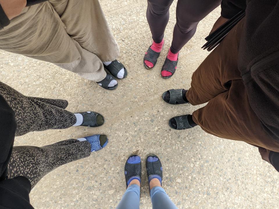 Aerial shot of feet in a circle at the Vietnamese border crossing