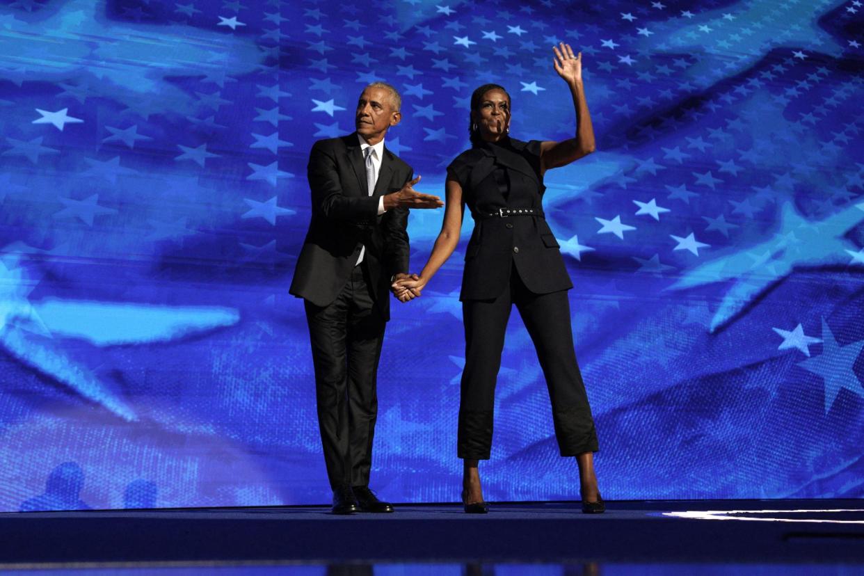 <span>Barack Obama and Michelle Obama take the stage at the DNC in Chicago, Illinois, on Tuesday.</span><span>Photograph: Gripas Yuri/Abaca/Rex/Shutterstock</span>