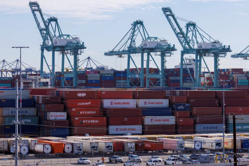 Stacked containers and cranes are shown at the Port of Los Angeles in Los Angeles, California, U.S. November 22, 2021. REUTERS/Mike Blake