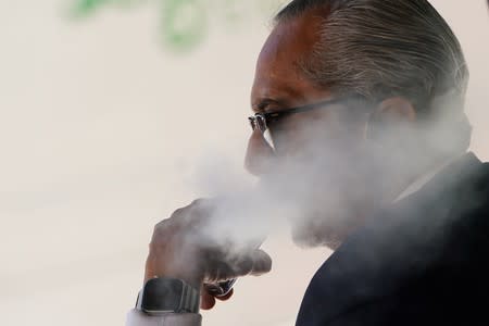 A man uses a vaping product in the Manhattan borough of New York